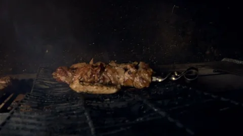 Piece of meat is fried on a grate Stock Footage 77412890
