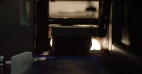 A piece of meat moves on a blue conveyor belt into an industrial packaging Vídeo Stock 339978384