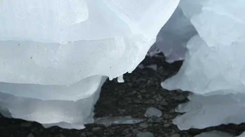 Piece of melting ice on an Arctic beach, Greenland Stock Footage