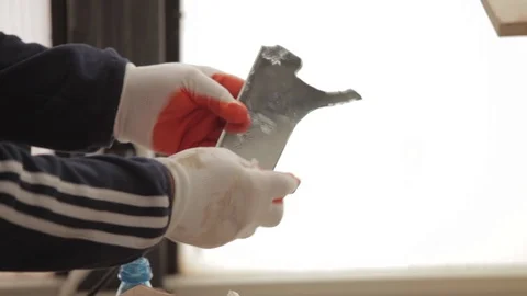 A piece of a mirror on the hands of a man Stock Footage 86475510