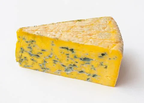 Piece of moldy cheese Stock Photos