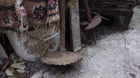 A piece of old carpet. Household garbage. Garden tools. Vídeos de archivo 116896551