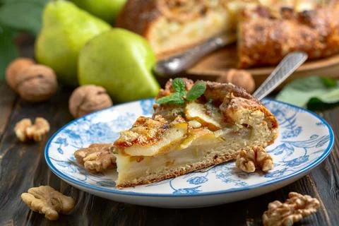 Piece of open pie (biscuits) with pears, blue cheese and walnuts. Stock Photos