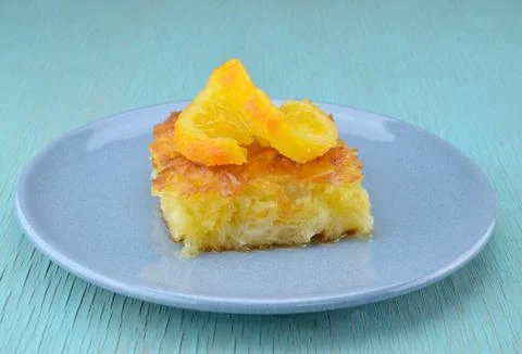 Piece of orange pie Stock Photos