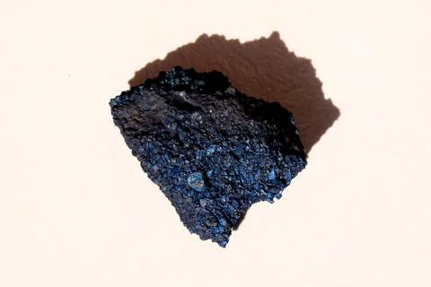 A piece of oxidized ferromanganese with interference tints (Fe-Mn alloy) Stock Photos