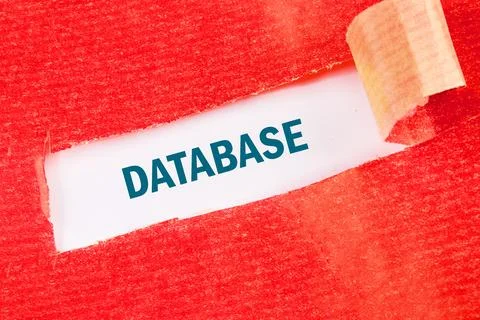A piece of paper labeled 'Database' is partially revealed from a torn red sur Stock Photos