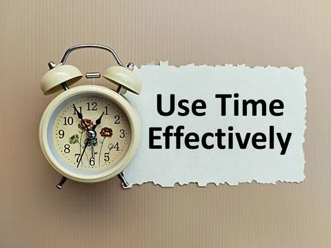 A piece of paper written Use Time Effectively with an alarm clock Foto stock