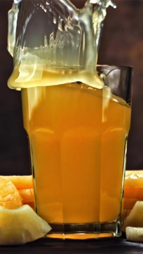 Piece of pineapple falls into pineapple juice. Filmed is slow motion 1000 fps Stock Footage 335292095