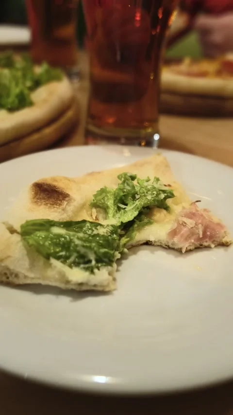 Piece of pizza at cafe table Stock Footage 220682154