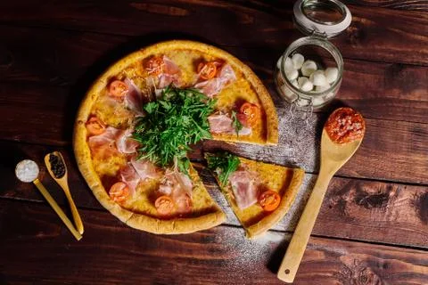 A piece of pizza close-up on the table Stock Photos