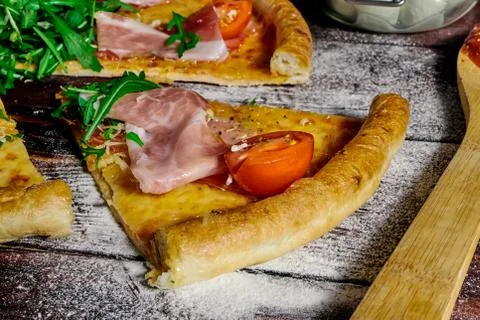A piece of pizza close-up on the table Stock Photos