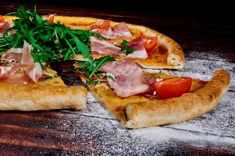 A piece of pizza close-up on the table Stock Photos