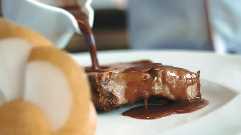 Piece of pork in a plate Stock Footage 129077807
