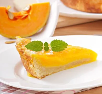 Piece of pumpkin pie on a plate Stock Photos