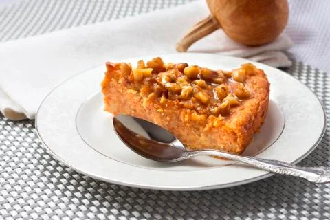Piece of pumpkin pie with walnuts Stock Photos