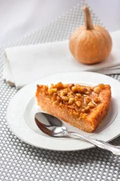 Piece of pumpkin pie with walnuts Stock Photos