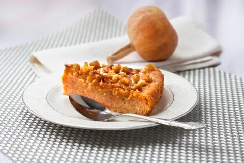 Piece of pumpkin pie with walnuts Stock Photos