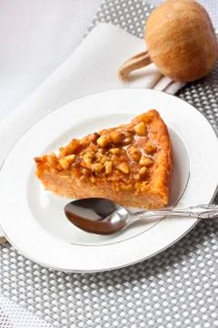 Piece of pumpkin pie with walnuts Stock Photos