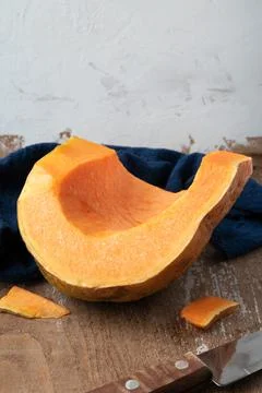Piece of pumpkin on rustic background Foto stock
