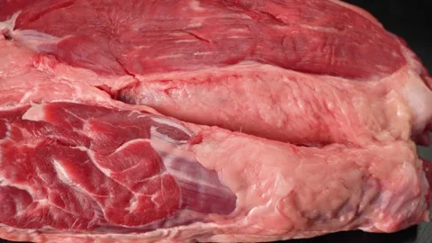 Piece of raw beef meat close up on black background 動画素材 147021912