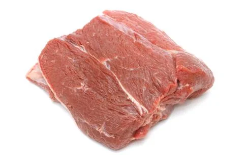 Piece of raw beef on white Stock-Fotos