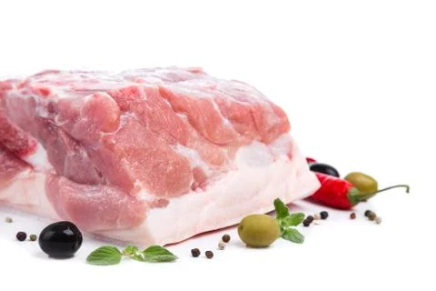 Piece raw meat with decor from on side Stock Photos