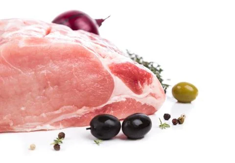 Piece raw meat with decor from on side Stock Photos