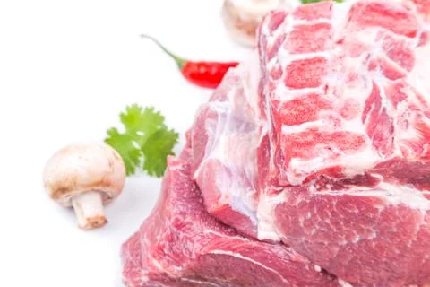 Piece raw meat with decor from on side Stock Photos