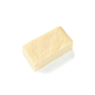 A piece of rectangular cheese without packaging. View from above. White backg Foto stock