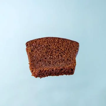 A piece of rye bread on a blue background Stock Photos
