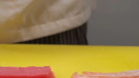 Piece of salmon in chief's hand Stock Footage 227537004