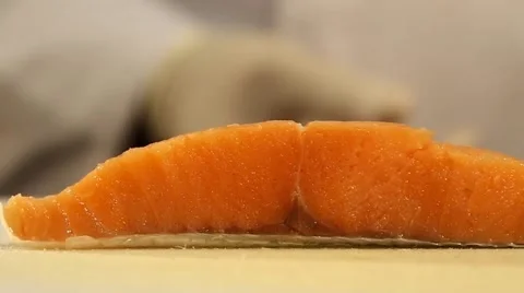 Piece of Salmon Fish on a Cutting Board Closeup Stock Footage 49499676