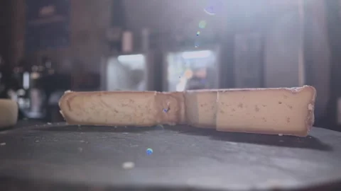 A piece Serra da Canastra Cheese that was cured in a cellar of a Brazilian Farm Stock Footage 258684086