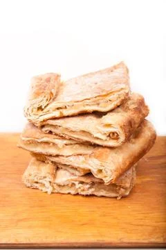 Piece of slice thin sweet pie on wooden Stock Photos