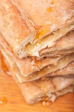 Piece of slice thin sweet pie on wooden Stock Photos