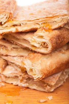 Piece of slice thin sweet pie on wooden Stock Photos