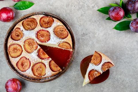 Piece of soft sponge cake with plum. Stock Photos