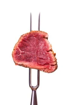 Piece of steak on a meat fork Stock Photos