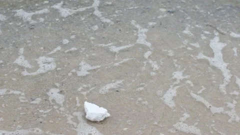 A piece of Styrofoam is nailed to the seashore Stock Footage