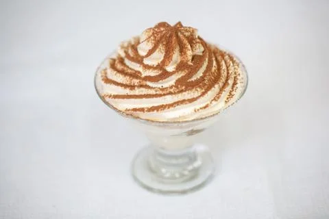 A piece of sweet cake with mint on the table, close-up Stock Photos