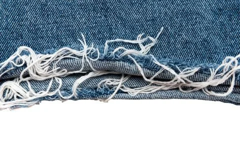 Piece of torn denim on a white background. Denim texture Stockfoto's