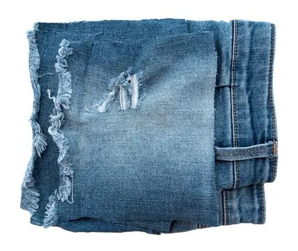Piece of torn denim on a white background. Denim texture Stock Photos