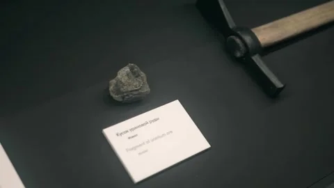 A piece of uranium ore and the pick used to mine it Video stock 323907710