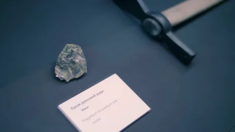 A piece of uranium ore and the pick used to mine it Video stock 323931920