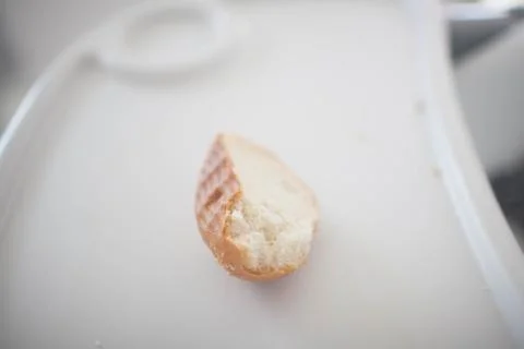 A piece of white bread on a children's table Foto stock