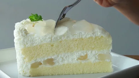Piece of white cake on plate close up. Stock Footage 79886156