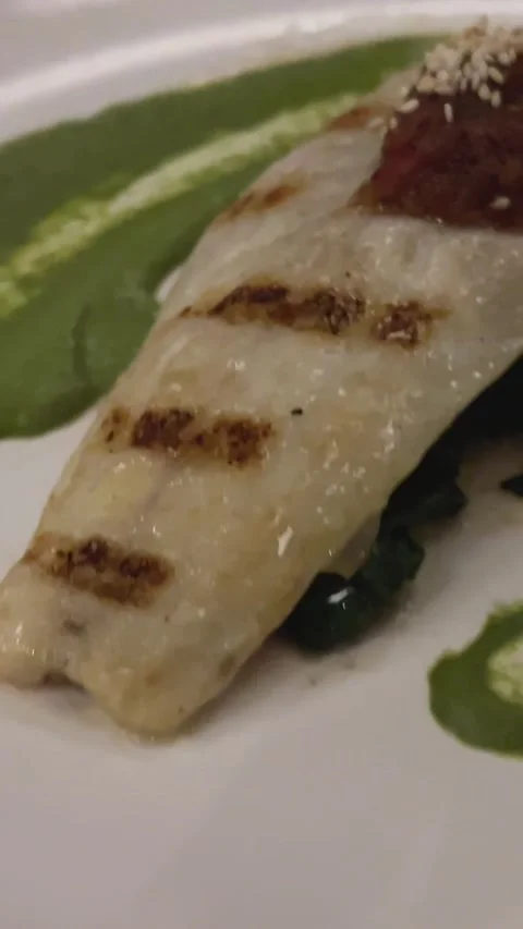 A piece of white fish with green pea puree 動画素材 302073179