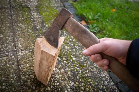 A piece of wood is split with an axe Stock Photos