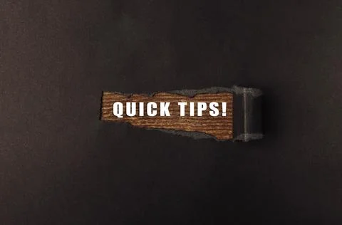 Piece of wood with the words quick tips written on it Stock Photos