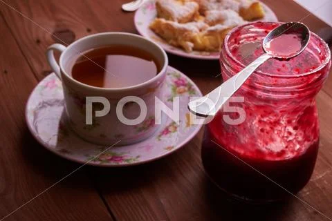 Pieces of apple pie on a plate with tea Stock Photos